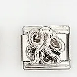 Macro shot of a stainless steel Italian charm link featuring a detailed octopus relief