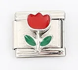 Macro shot of Italian style charm bracelet link with red tulip enamel flower detail