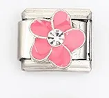 Macro detail of Italian style link charm featuring a pink flower with crystal center