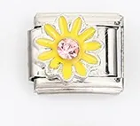 Detail of Italian charm bracelet link with yellow daisy and pink central gemstone
