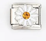 Macro detail of Italian modular charm with white daisy flower and yellow crystal
