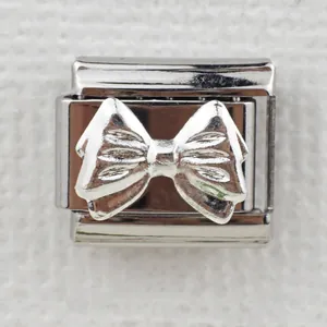 Italian style stainless steel modular link charm with detailed silver bow relief
