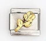 Macro shot of Italian style modular bracelet link with golden rose floral engraving