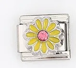 Detailed macro view of Italian charm link with yellow daisy flower and pink rhinestone