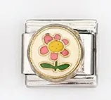 Detailed macro view of silver Italian charm link featuring a pink flower with green leaves