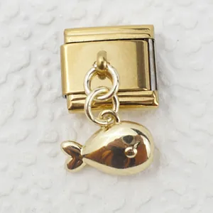 Detailed view of Italian charm link featuring a polished gold fish pendant on white texture