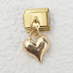 Macro shot of Italian gold heart charm with modular stainless steel base for bracelets