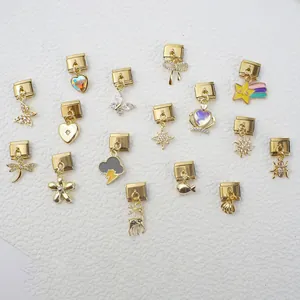 Italian charm bracelet links in gold finish featuring various enamel and crystal symbols