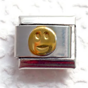 Detail of 9mm stainless steel charm with golden smiley face for Italian modular bracelet