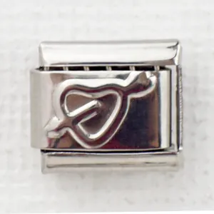 Close-up of 9mm stainless steel Italian charm with embossed silver heart and arrow design