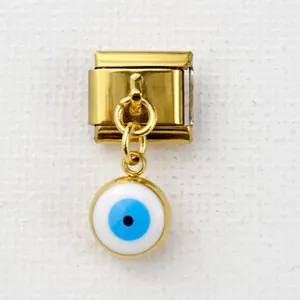 Italian charm link featuring a golden evil eye pendant on a stainless steel modular band