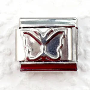 Detailed view of silver stainless steel Italian charm link with embossed butterfly design