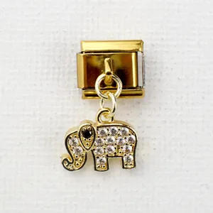 Macro detail of golden Italian charm link with crystal-encrusted elephant pendant charm