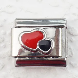 Detailed macro view of 9mm stainless steel charm link with red and black enamel double hearts