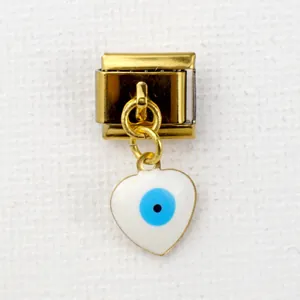 Detailed close-up of golden heart charm with blue evil eye on Italian starter link