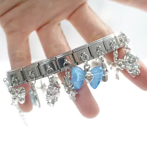 Italian charm bracelet featuring blue resin bow and silver stainless steel links