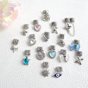 Italian charm links with diverse patterns like stars, hearts, and eyes for DIY bracelets