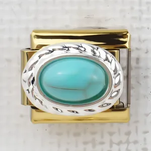 Macro shot of Italian style gold charm link with turquoise stone and rope edge detail