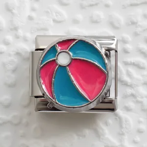 Detailed close-up of a stainless steel Italian charm with colorful beach ball enamel design