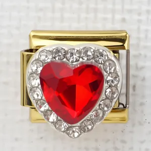 Macro detail of Italian charm with gold red heart gem and micro-pave zirconia border