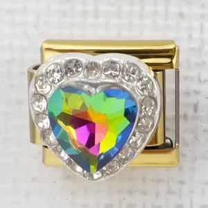 Macro detail of Italian charm heart link with iridescent gemstone and crystal pavé