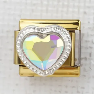 Macro detail of Italian charm link featuring a heart-shaped iridescent stone and crystals