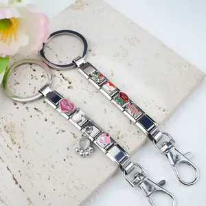 Detail of Italian charm keychains with enamel cat, heart and Mom charms in stainless steel