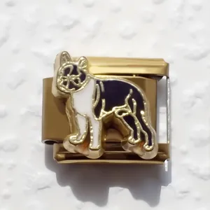 Macro view of gold-plated stainless steel Italian charm with black and white dog enamel
