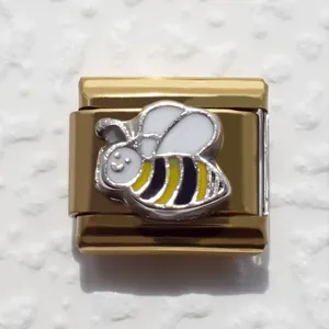 Detailed close-up of a gold-plated bee charm link for Italian modular DIY bracelets
