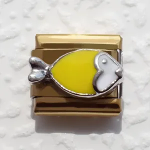 Detailed shot of a gold-plated stainless steel Italian modular charm with enamel fish design