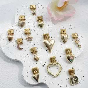 Detailed close-up of gold-plated charms including heart, star, and moon for DIY bracelets