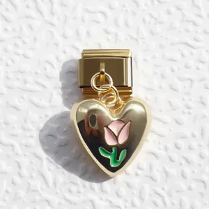 Italian charm bracelet component with gold heart pendant featuring a pink tulip design