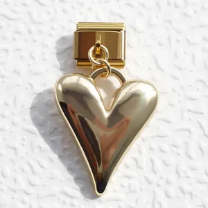 Detailed view of a polished gold heart pendant charm for Italian modular bracelets