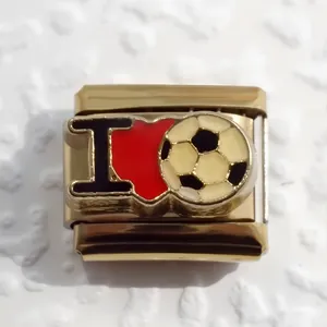 Macro shot of gold stainless steel Italian charm link with I Love Soccer design