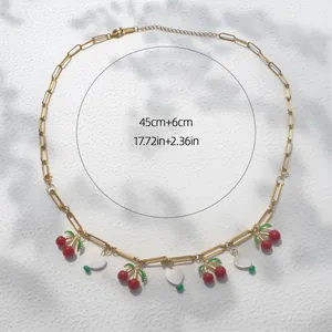 Gouden schakelketting met kersen en hart hangers, lengte 45cm met 6cm verlengketting