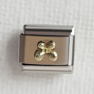 Italienisches Modularmband aus Edelstahl mit einem goldenen Schmetterlingsdesign