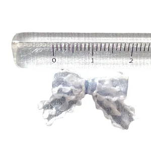 Detailed view of a 2cm light blue mesh bow with white lace trim and scale measurement