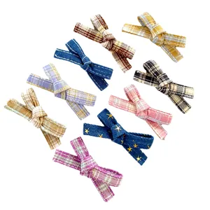 Set of 9 colorful plaid and star pattern bow hair clips for DIY doll clothing decor