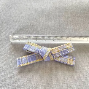 Blue and yellow plaid ribbon bow measuring 7cm for DIY doll clothing accessories