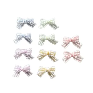 Set of 10 mini lace bows in pastel colors for DIY hair accessories and clothing crafts