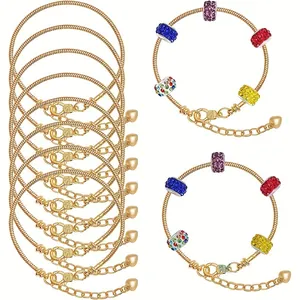 Detail of gold snake chain bracelets with colorful crystal beads and lobster clasp