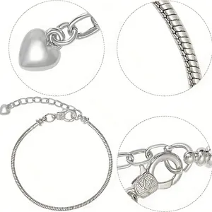 Polished silver snake chain bracelet with heart charm and lobster clasp closure