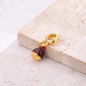 Golden cherry chocolate cupcake charm bead for DIY bracelets featuring brown enamel details