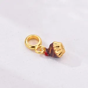 Golden alloy cupcake charm with chocolate enamel and cherry detail for DIY bracelets