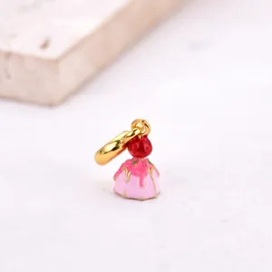 Detailed view of pink strawberry cupcake charm with gold plating and enamel finish