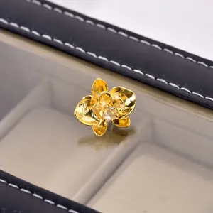Exquisite gold-plated orchid stud earrings with pear-shaped cubic zirconia in a gift box