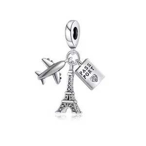 Silver travel-themed charm with Eiffel Tower, airplane, and passport for DIY bracelets