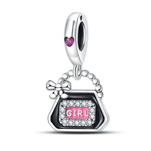Silver handbag charm with black enamel, pink heart gem and GIRL engraving on white background