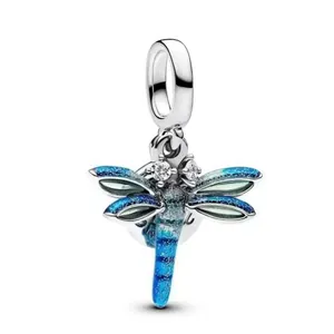 Silver dragonfly charm with blue-green gradient enamel and glittering stone accents