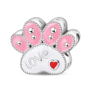 Silver animal paw charm with pink and white enamel and heart-shaped love engraving